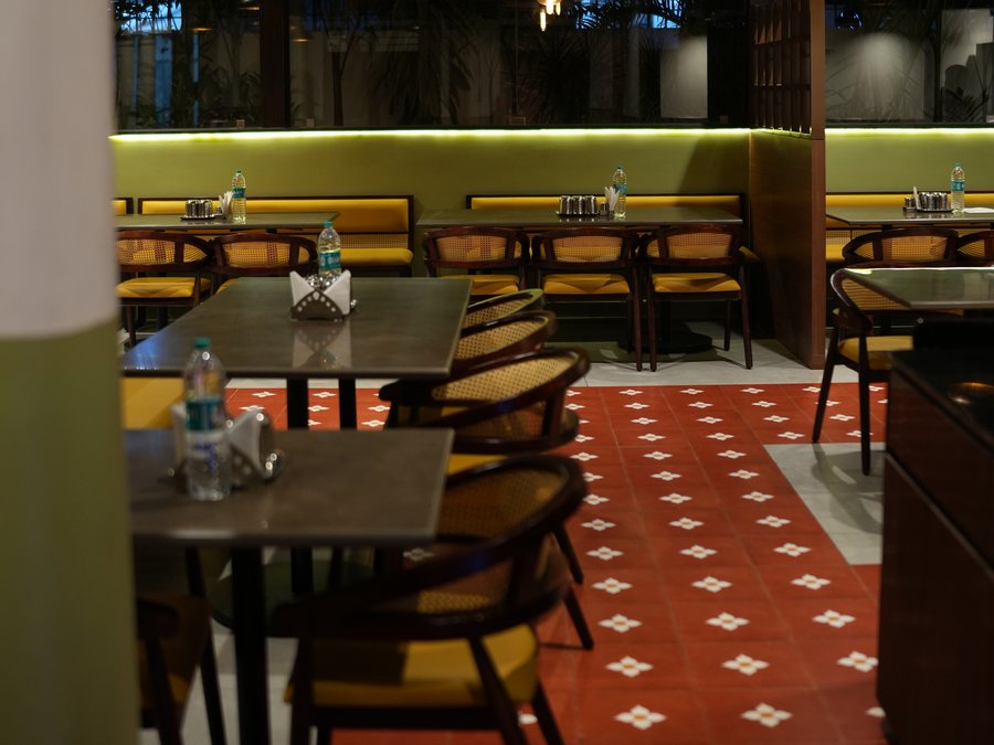 Along the runway between the tables