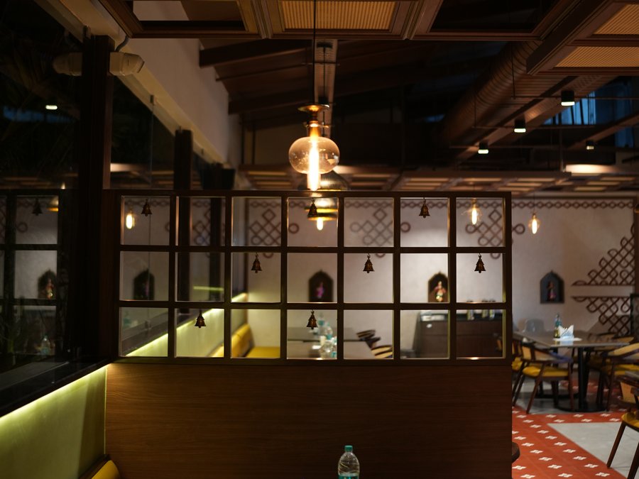 A booth behind the timber grid partition