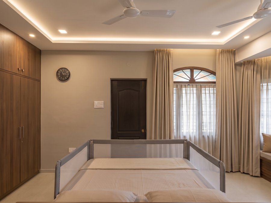A bedroom with the original arched, coloured-glass window kept (visualisation)